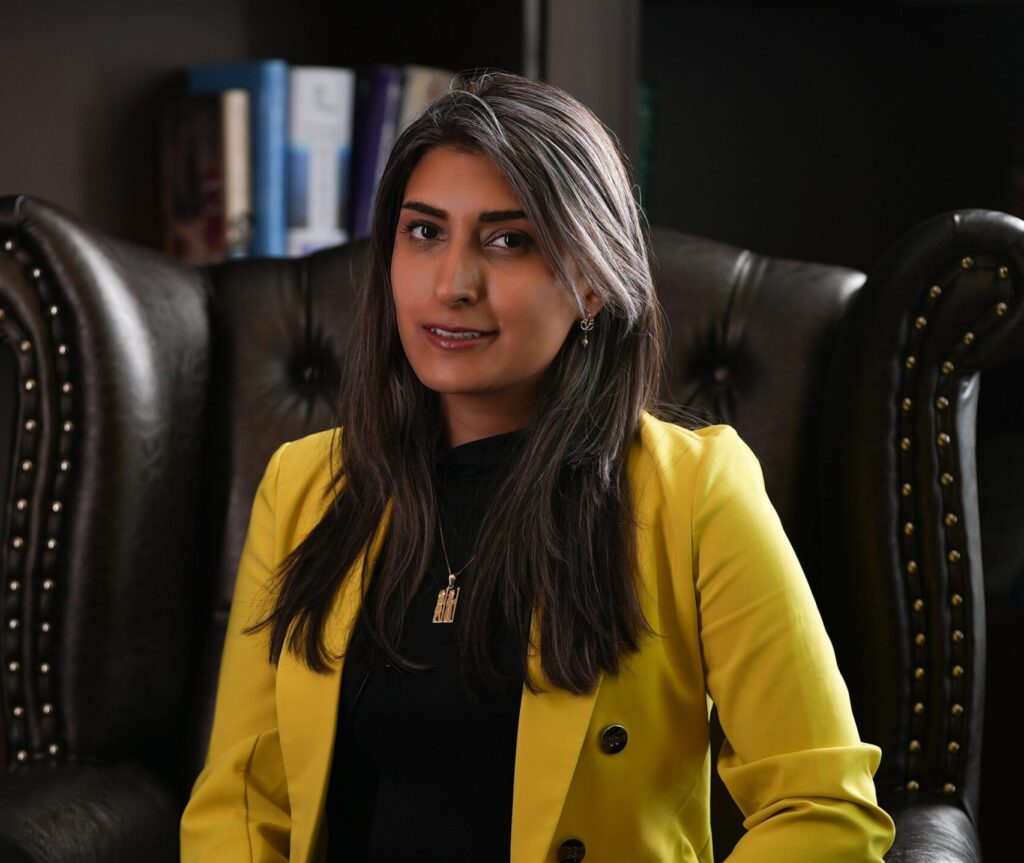 Portrait of Mona Haratianfar, microbiome specialist, in a yellow blazer